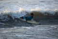 Kovalam, Chennai, Tamilnadu, India - Ã¢â¬Å½Ã¢â¬Å½August 9th Ã¢â¬Å½2021: Young boy Indian surfer surfing and practicing on the beach waves